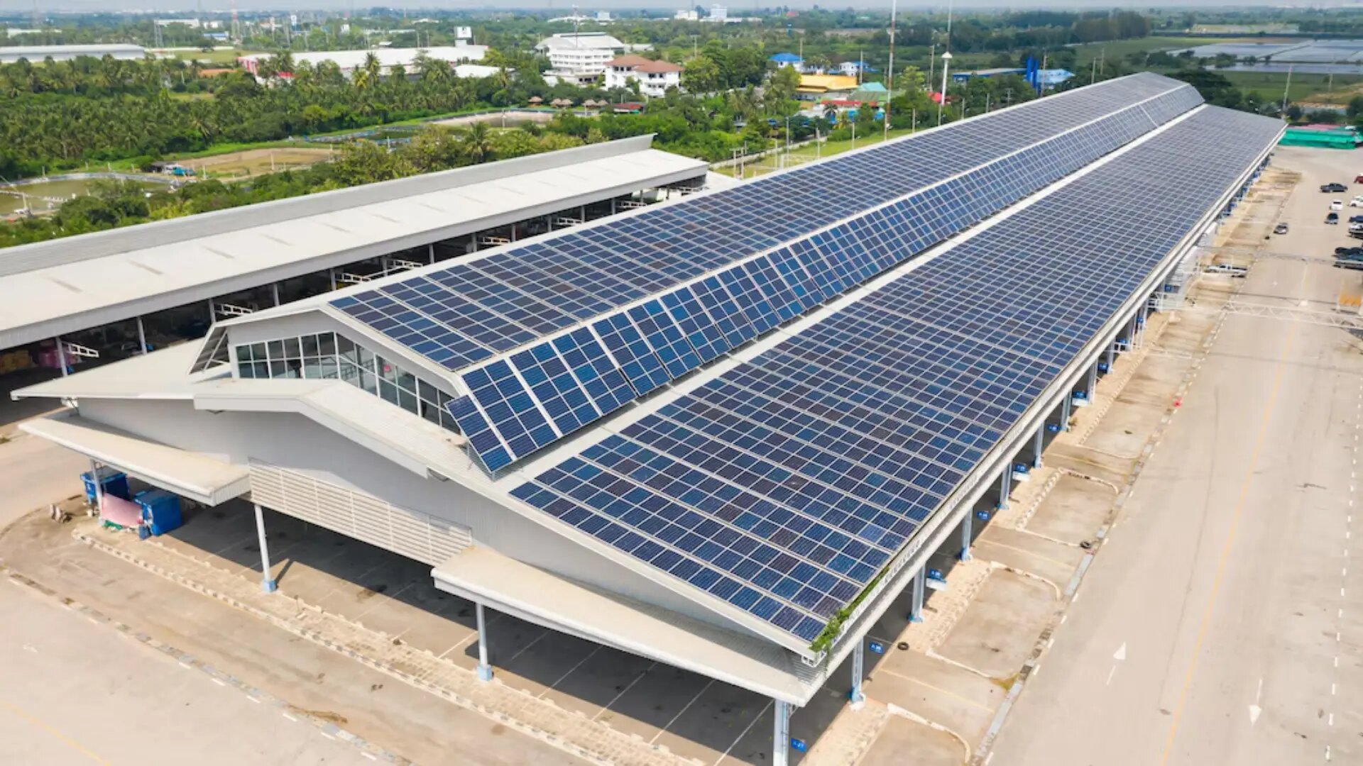 Commercial building roof covered with solar panels