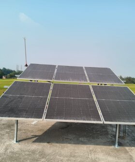 Solar panels and inverter equipment installed at a site